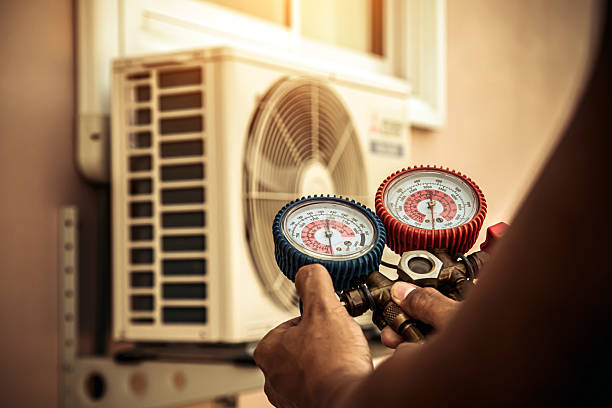 Professional Heat Pump Repair technician working in Devine, TX